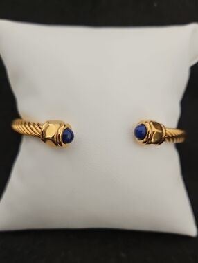 Gold Tone Cuff Bracelet with Blue Stone Terminals